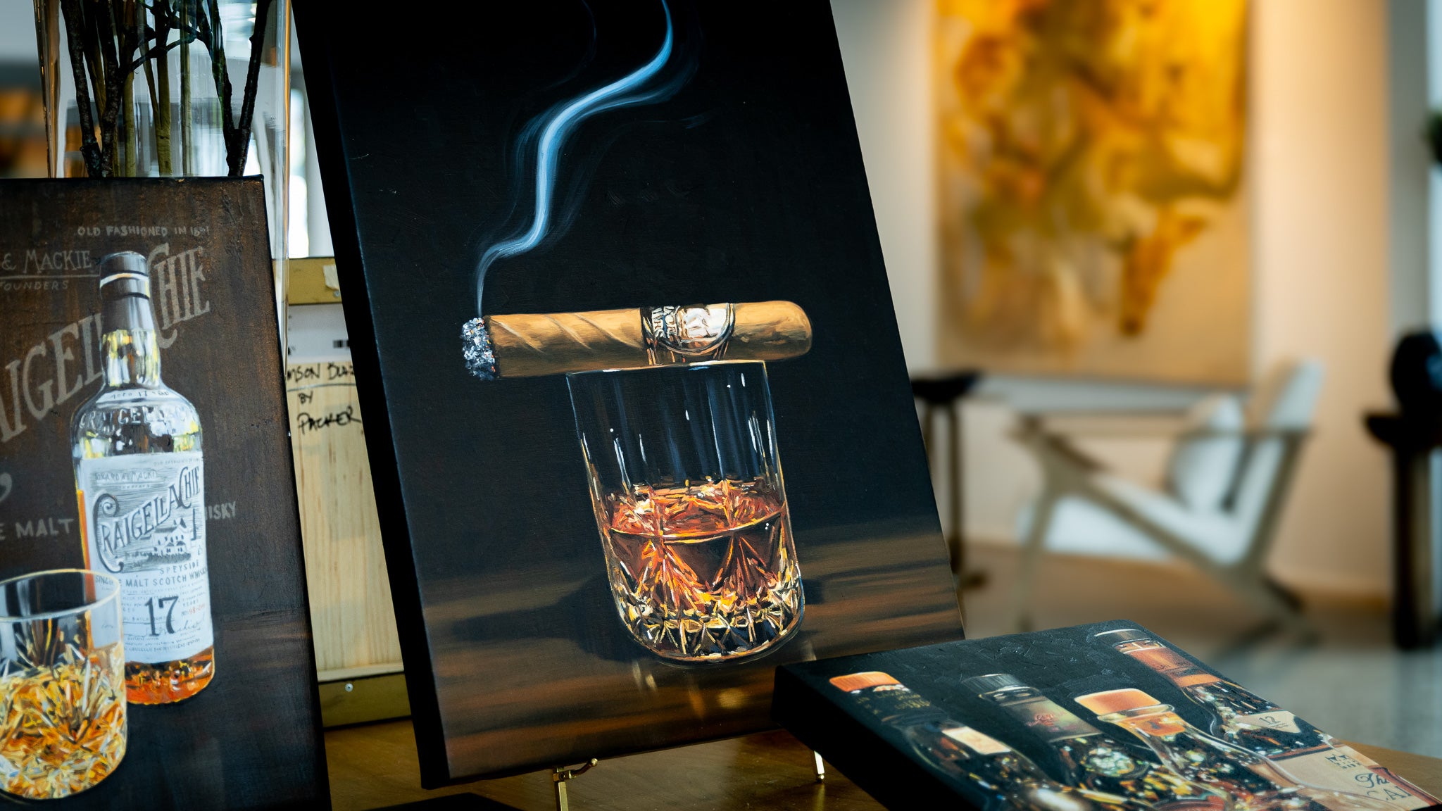 Cigar and glass of whiskey on a table with a blurred background