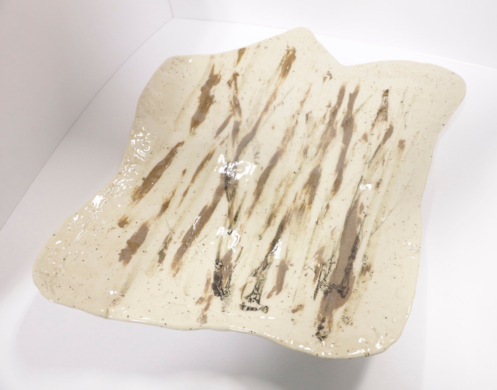 Sculpture “Cream & Bronze Plate” by Dina Egar.